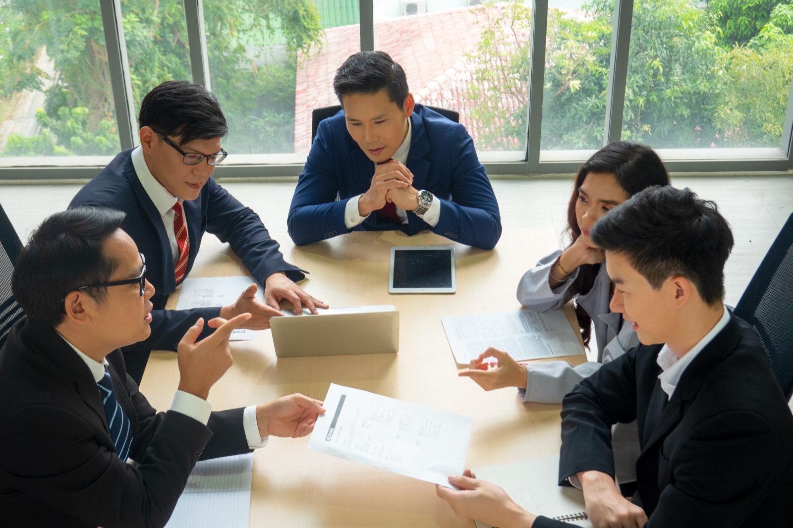 Executive team meeting discussing AI strategy